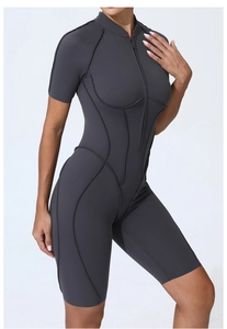 Detail shot of the front zipper and corset-style black stitching on a dark grey bodysuit