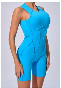Close-up of blue athletic bodysuit featuring 3D decorative stitching and side seams