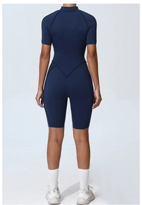 Detail view of V-shaped back stitching on navy blue short sleeve athletic bodysuit