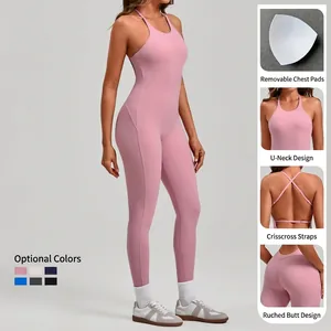 Pink athletic yoga romper with U-neck, adjustable cross straps and peach lift effect