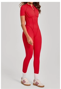Detail shot of the stand collar and zipper closure on the red athletic jumpsuit