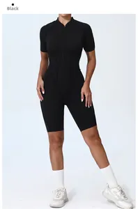 Close-up of black athletic jumpsuit featuring front zipper and sculpting seam details
