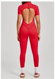 Detail of red short-sleeve yoga bodysuit featuring a teardrop cutout back design