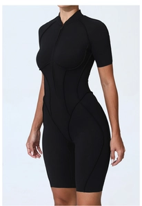 Close-up detail of front zipper closure and stitching on black short sleeve bodysuit