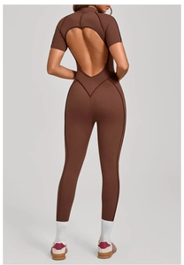 Detail view of the teardrop open back and short sleeves on a brown yoga bodysuit