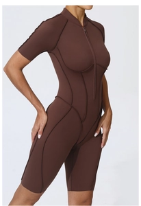 Detail of dark brown short sleeve yoga bodysuit featuring standing collar and front zipper