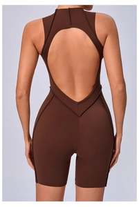 Macro detail of the seamless backless yoga bodysuit with athletic stitching and cutout