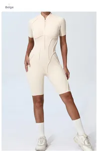 Detailed view of beige yoga bodysuit with ergonomic stitching and front zipper