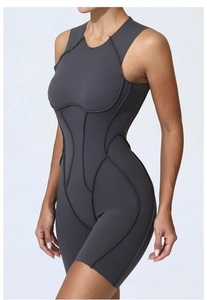 Detail view of dark grey athletic bodysuit featuring supportive contour seams and high-stretch fabric