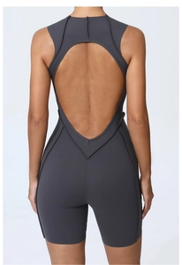 Detail of the open back cutout design and reinforced seams on the dark grey yoga bodysuit
