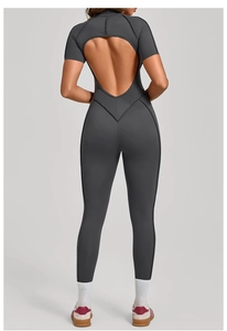 Detail of grey athletic jumpsuit showing large diamond cutout back and sleek fit