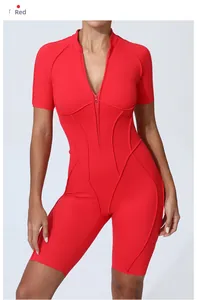 Close-up of red athletic bodysuit showing front zipper and ergonomic stitching details