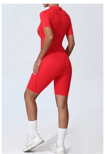 Detail of red athletic bodysuit showing decorative seams and high-elastic compression fabric