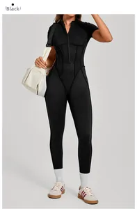 Close-up of black tight-fitting yoga jumpsuit with stand collar and zipper detail
