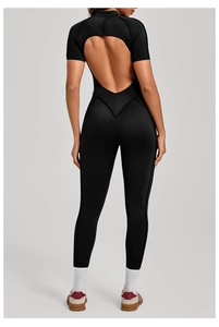 Detail of moisture-wicking black athletic jumpsuit featuring a stylish back cutout design