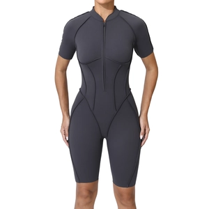 Slim fit dark grey short sleeve yoga bodysuit with front zipper and athletic seam detailing