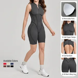 Body sportivo grigio scuro con schiena scoperta, mezza zip e cuciture modellanti