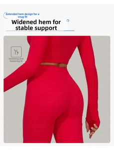 Detail of red high-waist yoga leggings and long sleeve crop top with wide supportive hemline