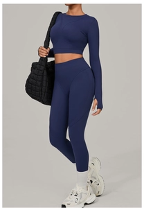Detail of navy blue yoga set with thumbhole sleeves and high waisted leggings