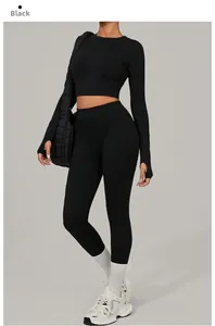Detail of black long-sleeved crop top and high-waist leggings with thumb holes