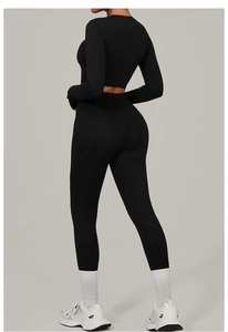 Detail of black high-waisted yoga set showing the lifting effect and tight fit for women