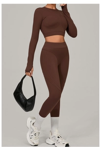 Close-up of chocolate brown slim fit long sleeve top with curved stitching detail