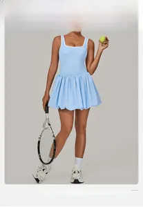 Detail of light blue pleated tennis dress with contrast stitching and athletic back design