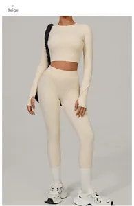 Detail view of beige yoga set featuring long sleeve thumb-hole top and high waist leggings