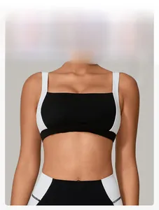 Detail view of high-stretch sports bra and leggings set with contrast black and white binding
