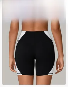 Close-up of high-waist fitness shorts featuring side contrast panel and butt lifting seams