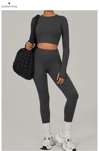 Detail of dark charcoal yoga set with long sleeve crop top and high waist leggings
