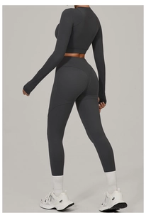 Detail view of charcoal grey high-waist leggings with heart-shaped lifting seam on back
