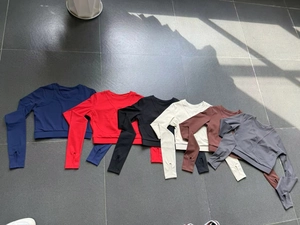 Detailed flat lay of six slim fit athletic long sleeve tops with thumbholes for women