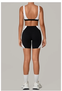 Detail view of backless yoga set with color-block U-neck bra and high waist cycling shorts