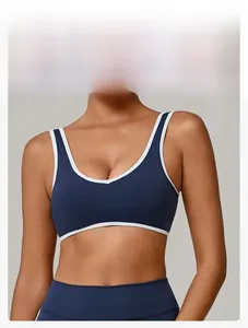 Detail of navy sports bra with white piping and wide straps for comfortable support