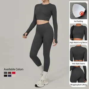 Women's dark grey seamless yoga set with long sleeve crop top and high waist leggings