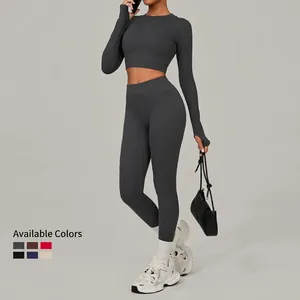 Women's dark gray long sleeve cropped top and high waisted yoga leggings set