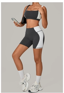Detail view of backless grey yoga set featuring square neck bra and high waist biker shorts