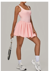 Pink backless tennis dress with white trim and pleated skirt for athletic performance