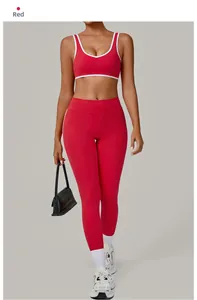 Close-up of red yoga set featuring white contrast piping on the U-neck sports bra