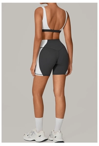 Back view of high-waist yoga shorts with heart-shaped lifting seam and white sports bra