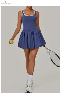 Detail of glazed purple tennis dress featuring contrast piping and pleated hem for sports