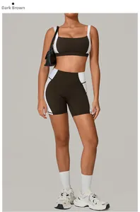 Detail of dark brown backless yoga set with white contrast panels and high-waisted shorts