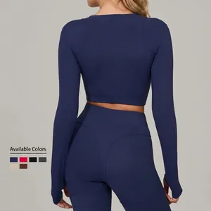 Ensemble de yoga bleu foncé pour femme avec haut à manches longues et legging de compression