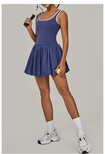 Close-up of contrast white piping on navy blue backless sports tennis dress fabric