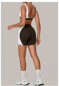 Detail view of backless yoga set featuring black and white contrast high-waist shorts