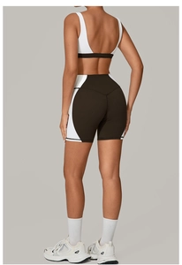 Close-up of the back-tie yoga set showing black and white color-block detail and fabric texture