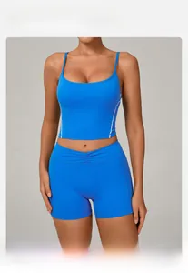 Macro shot of bright blue yoga sports bra set with white side stripes and fine straps