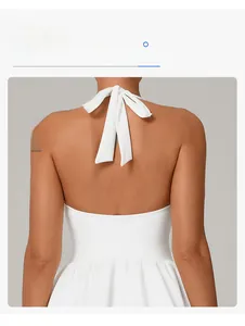 Detail of white backless halter top showing elegant lace-up design and slim fit