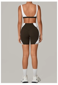 Back view of a black and white yoga set with a U-shaped open back and high waist shorts